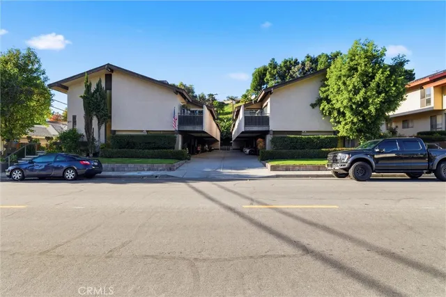 a view of a car parked in front of a house