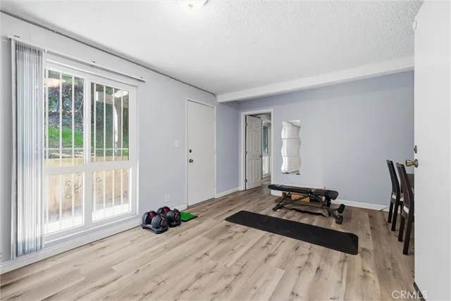 a room with a bed and a large window