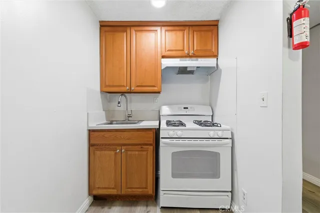 a kitchen with a stove top oven