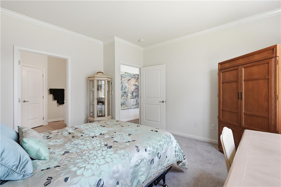 4120 Eveningstar Road Emmaus, PA 18049 - Photo 39 of 62 Elegant crown molding adorns this spacious sleeping sanctuary, offering serene comfort and privacy.