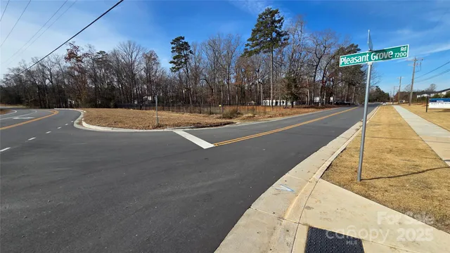 a view of swimming pool with palm trees