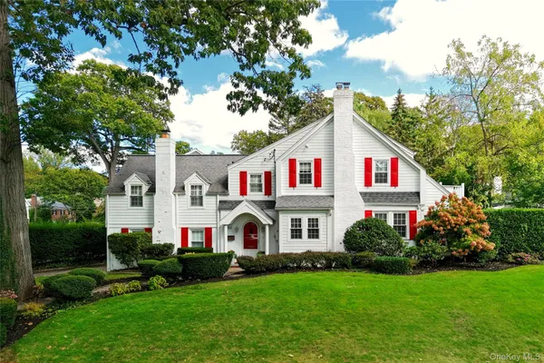 a front view of house with yard and green space