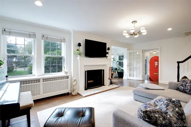 a living room with furniture fireplace and flat screen tv