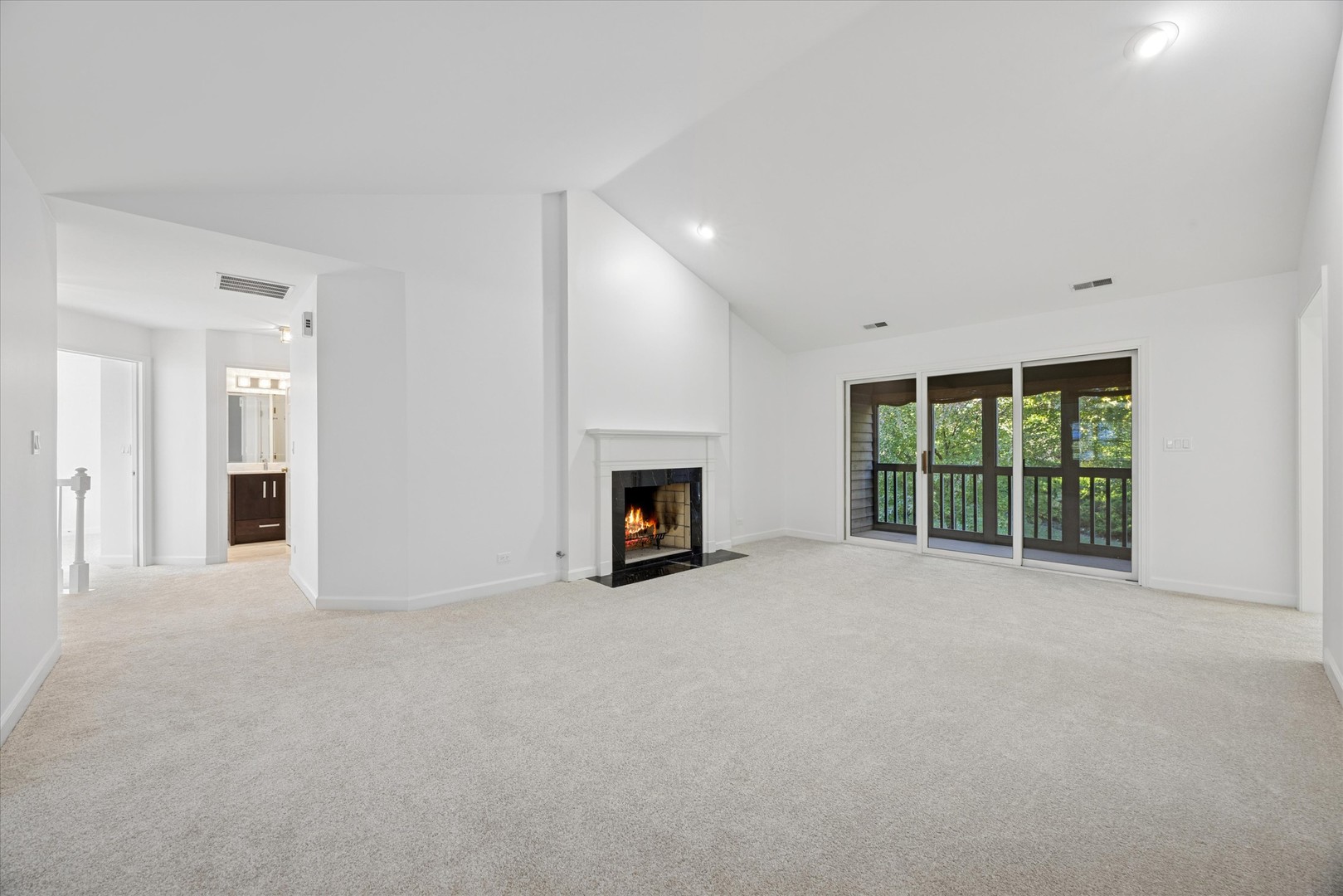 179 Foxborough Place Burr Ridge, IL 60527 - Photo 2 of 18 a view of an empty room with a fireplace and a window