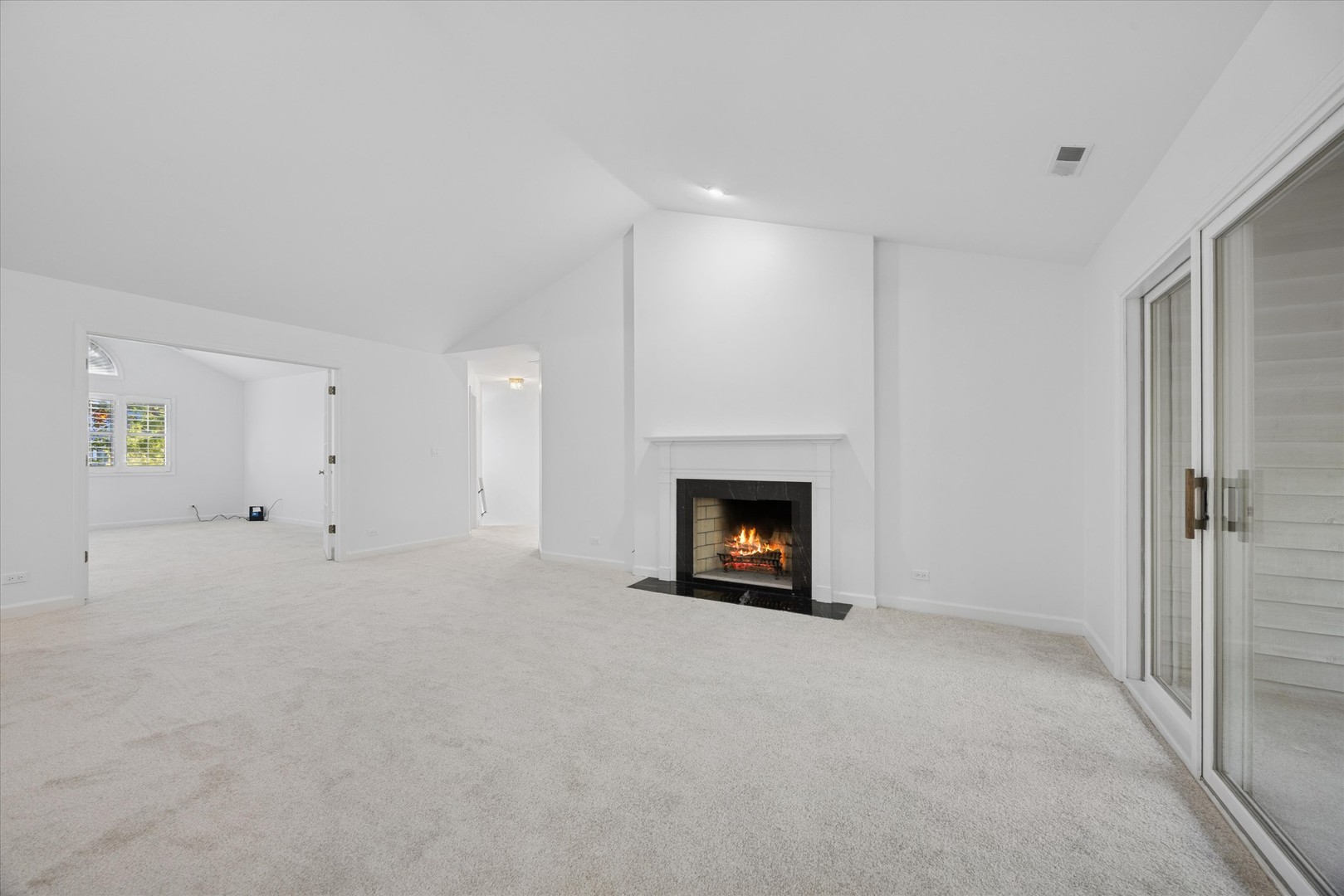 179 Foxborough Place Burr Ridge, IL 60527 - Photo 3 of 18 a view of an empty room with a fireplace