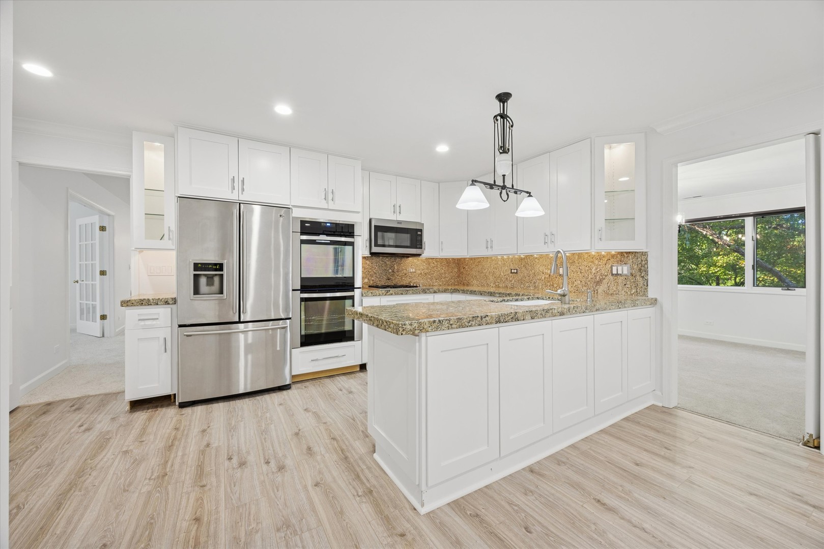 179 Foxborough Place Burr Ridge, IL 60527 - Photo 5 of 18 a kitchen with refrigerator cabinets and wooden floor