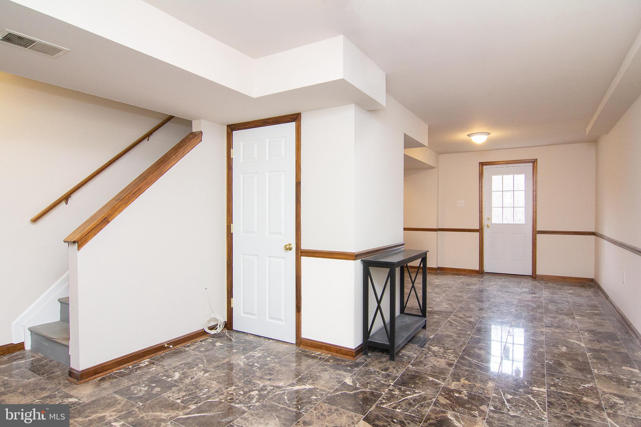 7315 Woodbine Road, Unit A Woodbine, MD 21797 - Photo 24 of 35 LL Family Room w/ ceramic tile