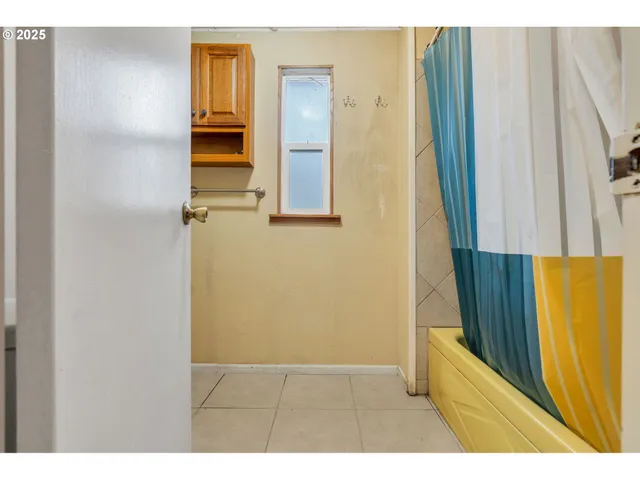 a view of a bathroom from a hallway