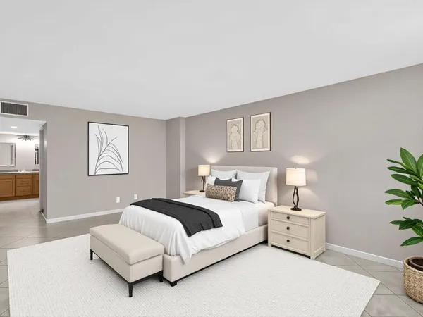 a bedroom with a bed and a couch
