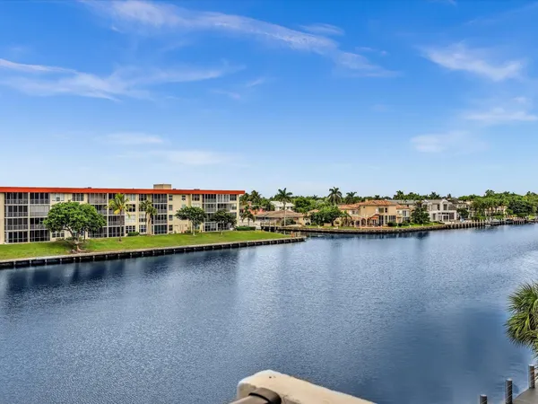 a view of a lake with a building in the background