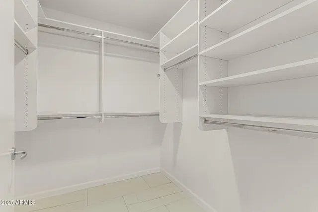 a view of an empty walk in closet
