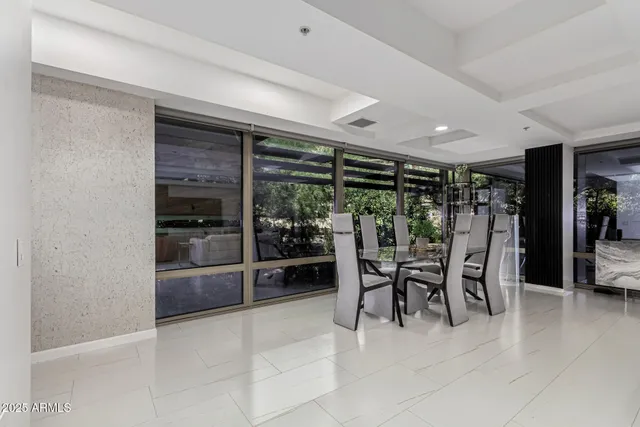 a dining space with furniture and a ceiling fan