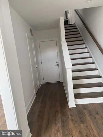 a view of a hallway view with staircase