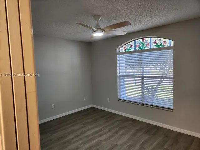 a view of a bathroom from a hallway