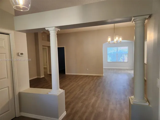 a view of entryway with wooden floor