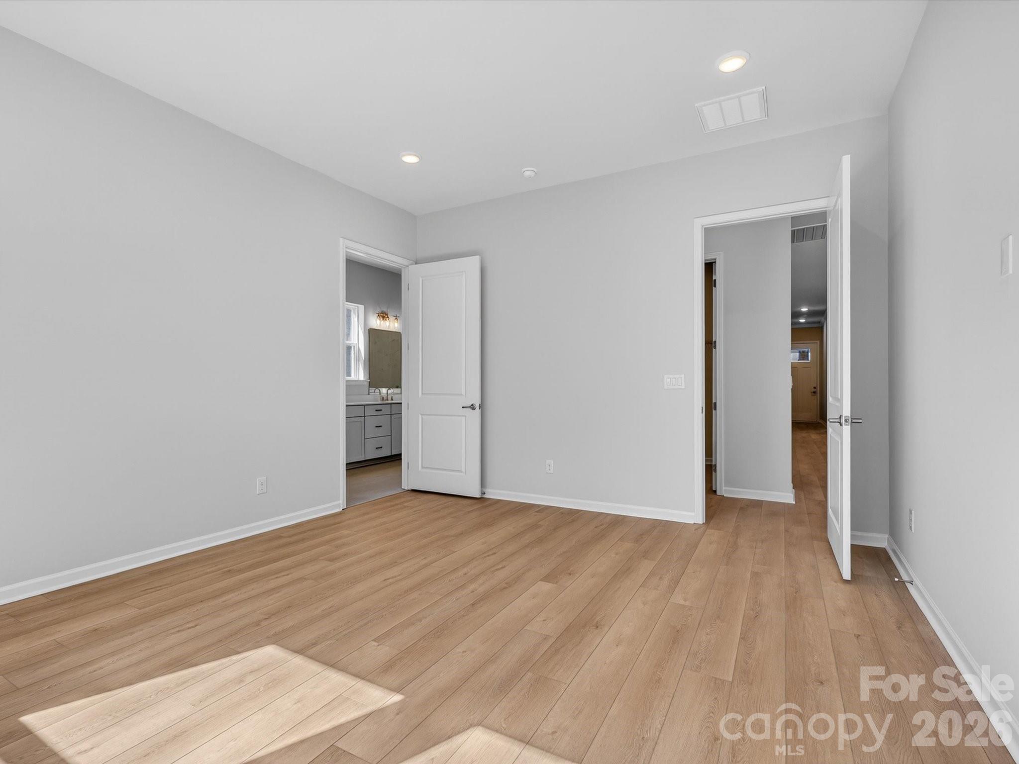1007 Meander Lane Waxhaw, NC 28173 - Photo 13 of 35 a view of an empty room with wooden floor and closet