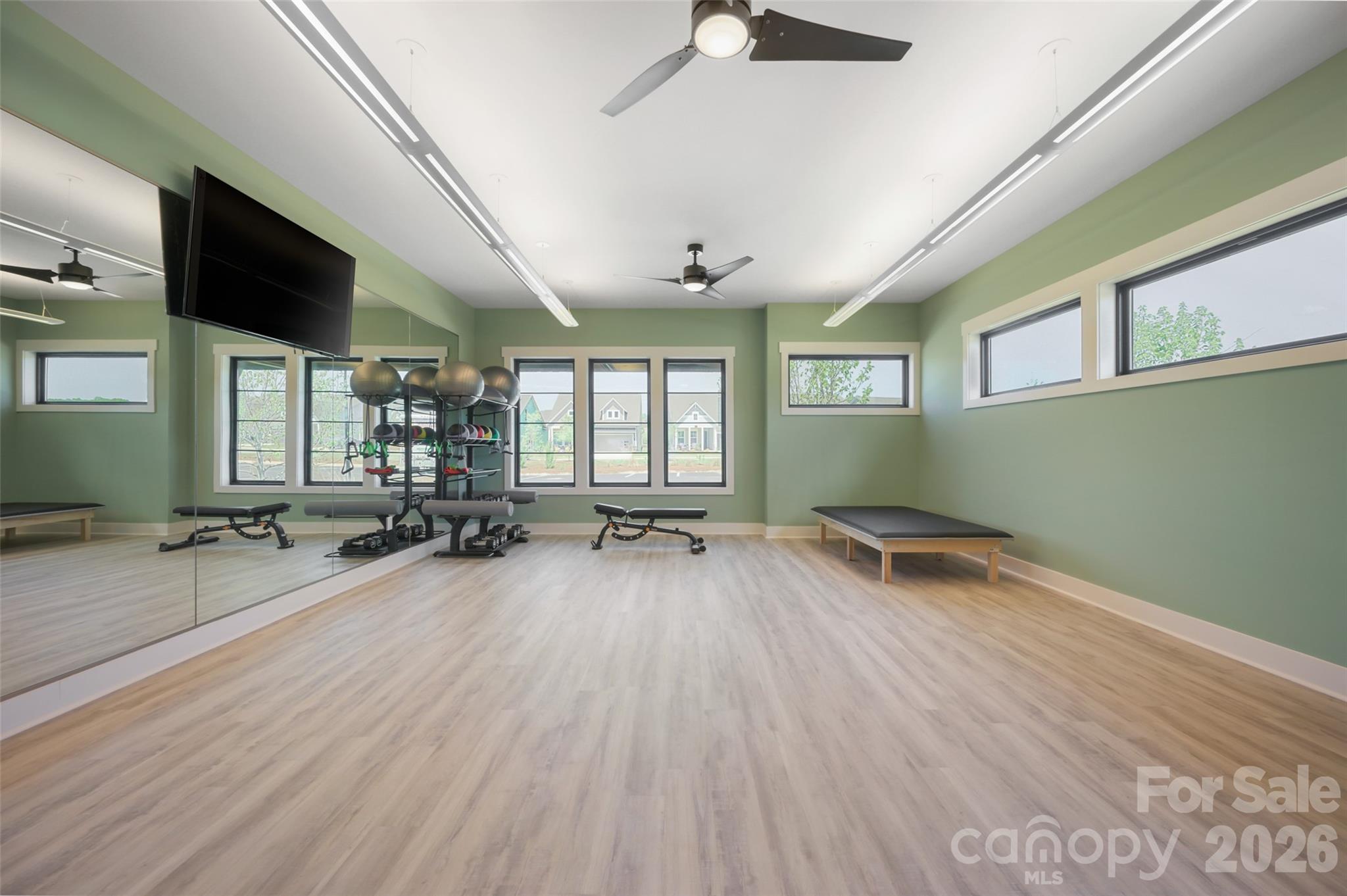 1007 Meander Lane Waxhaw, NC 28173 - Photo 26 of 35 a room with lots of wooden furniture and a wooden floor