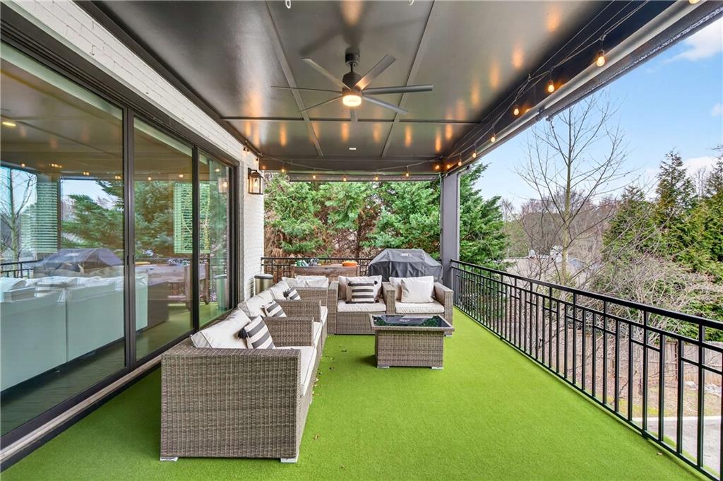 2974 Hermance Drive Northeast Atlanta, GA 30319 - Photo 13 of 38 a living room with patio furniture and a potted plant