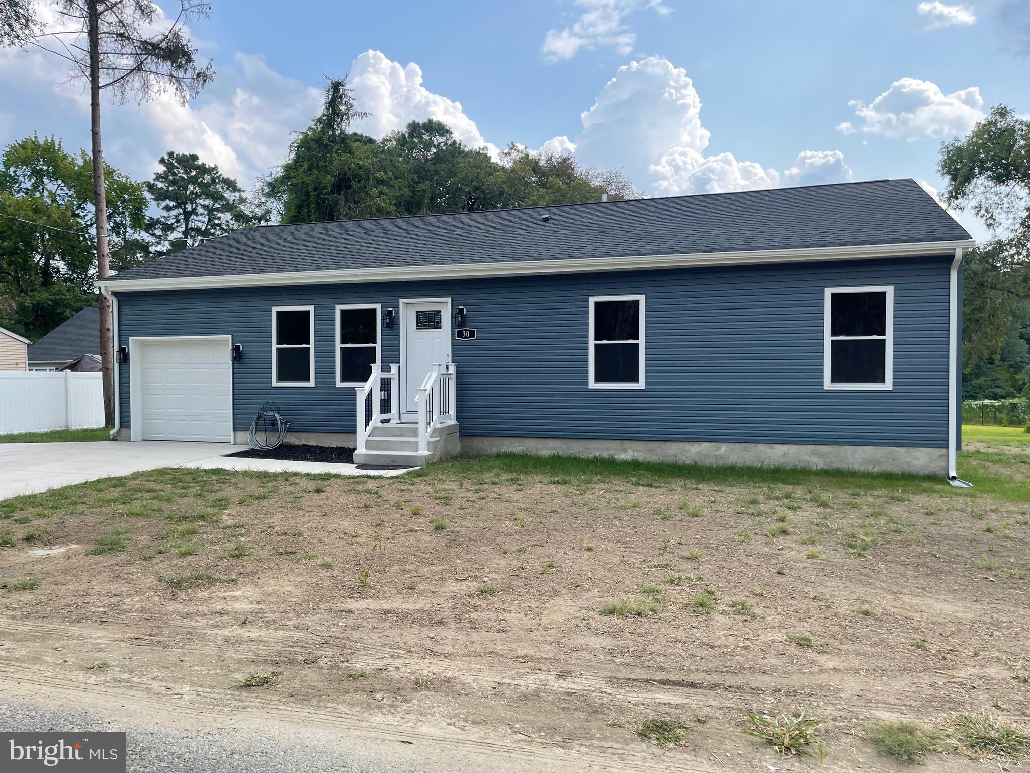 a backyard of a house with seating space