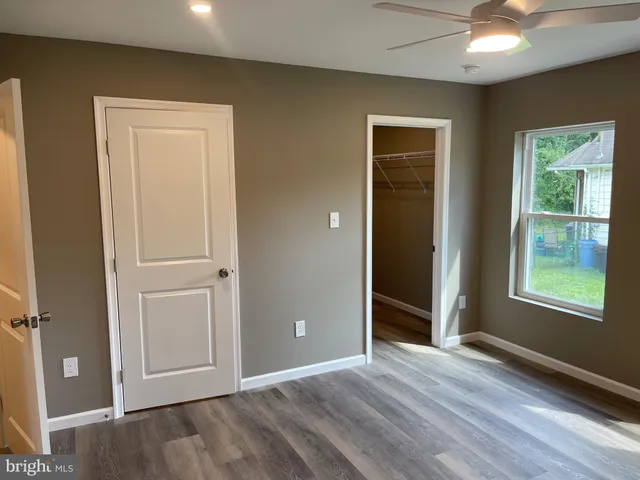 a bathroom with a shower and a sink