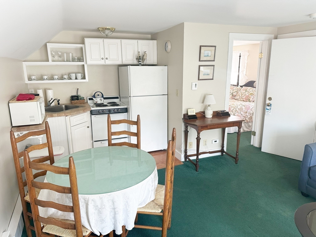 25 Simpson's Lane Edgartown, MA 02539 - Photo 10 of 18 a view of a dining room with furniture and wooden floor