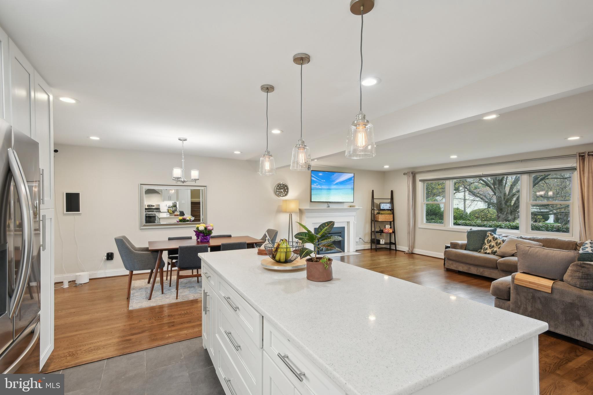 505 Devonshire Drive Northeast Vienna, VA 22180 - Photo 14 of 46 a view of a kitchen with kitchen island dining table and chairs