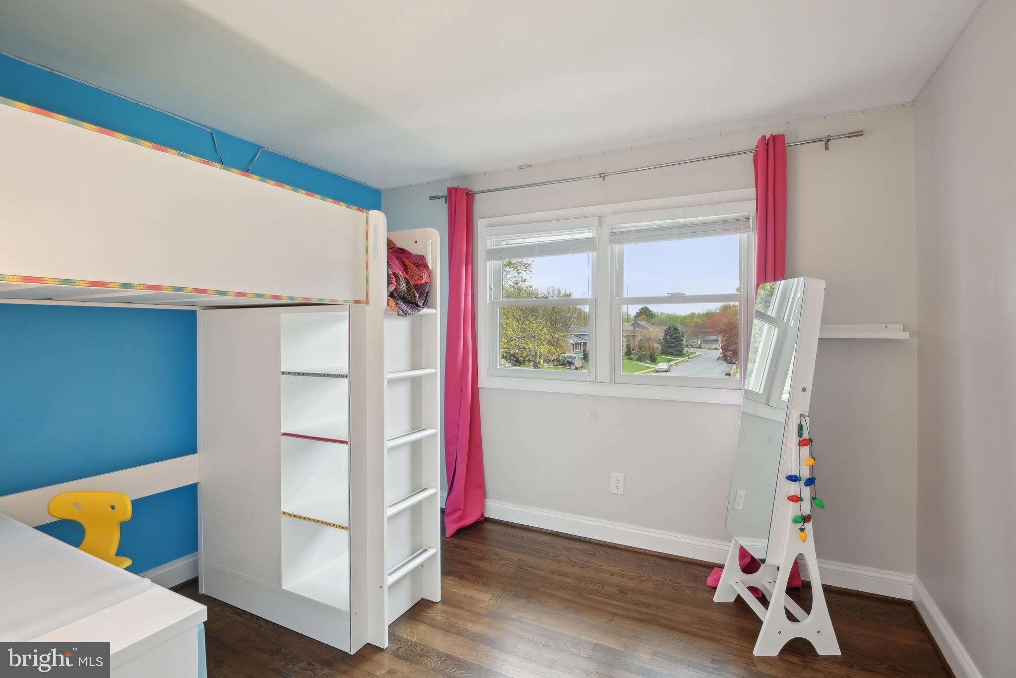 505 Devonshire Drive Northeast Vienna, VA 22180 - Photo 15 of 46 a view of an empty room with wooden floor and a window