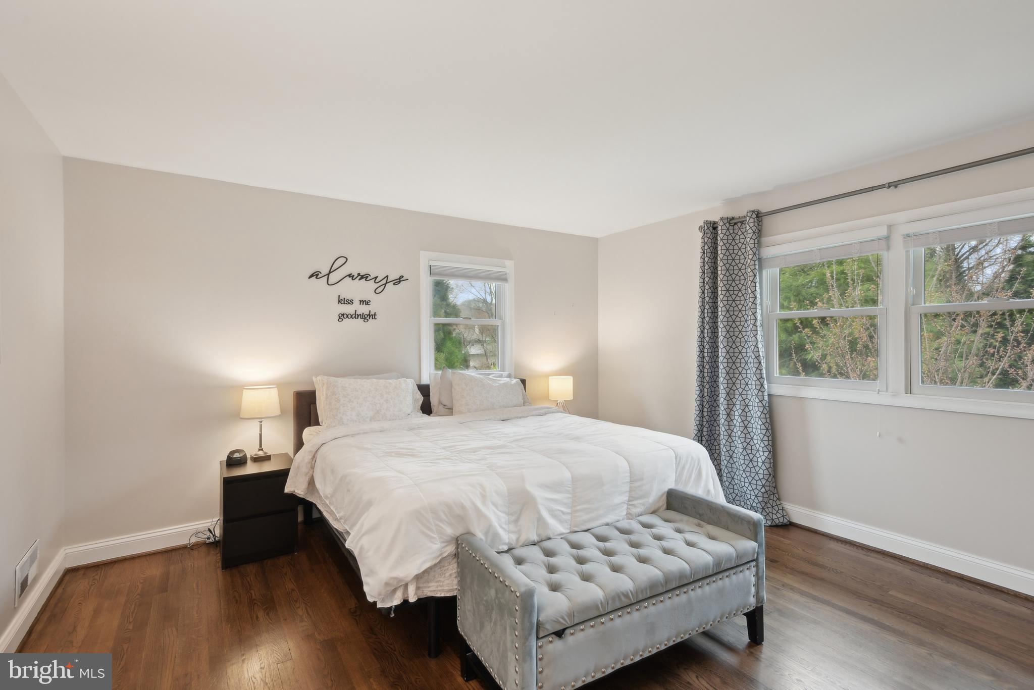 505 Devonshire Drive Northeast Vienna, VA 22180 - Photo 19 of 46 a bedroom with a bed and wooden floor