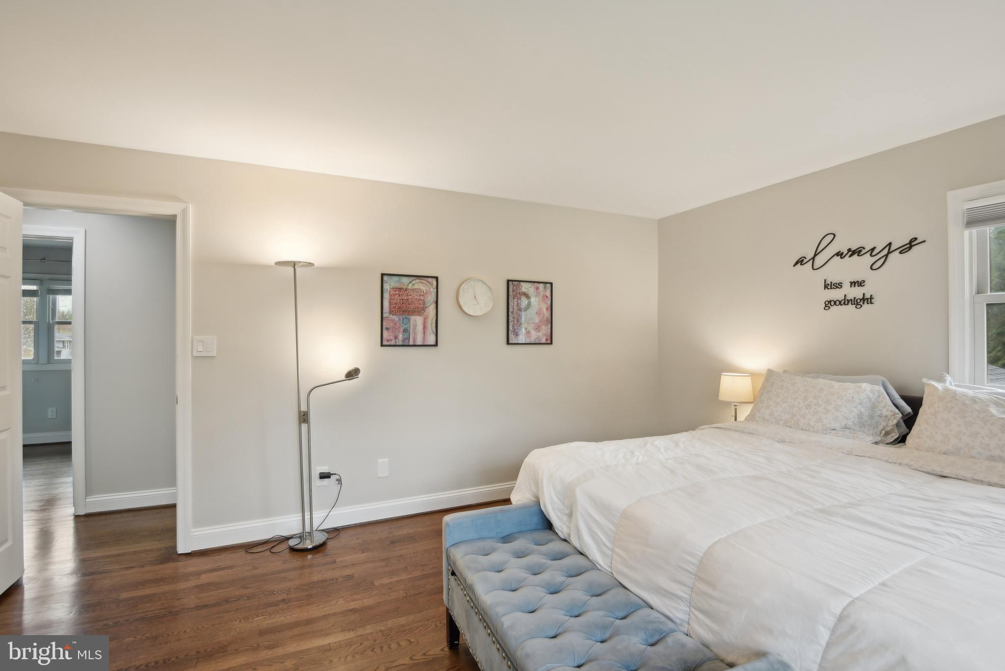 505 Devonshire Drive Northeast Vienna, VA 22180 - Photo 20 of 46 a bedroom with a bed and a painting on the wall