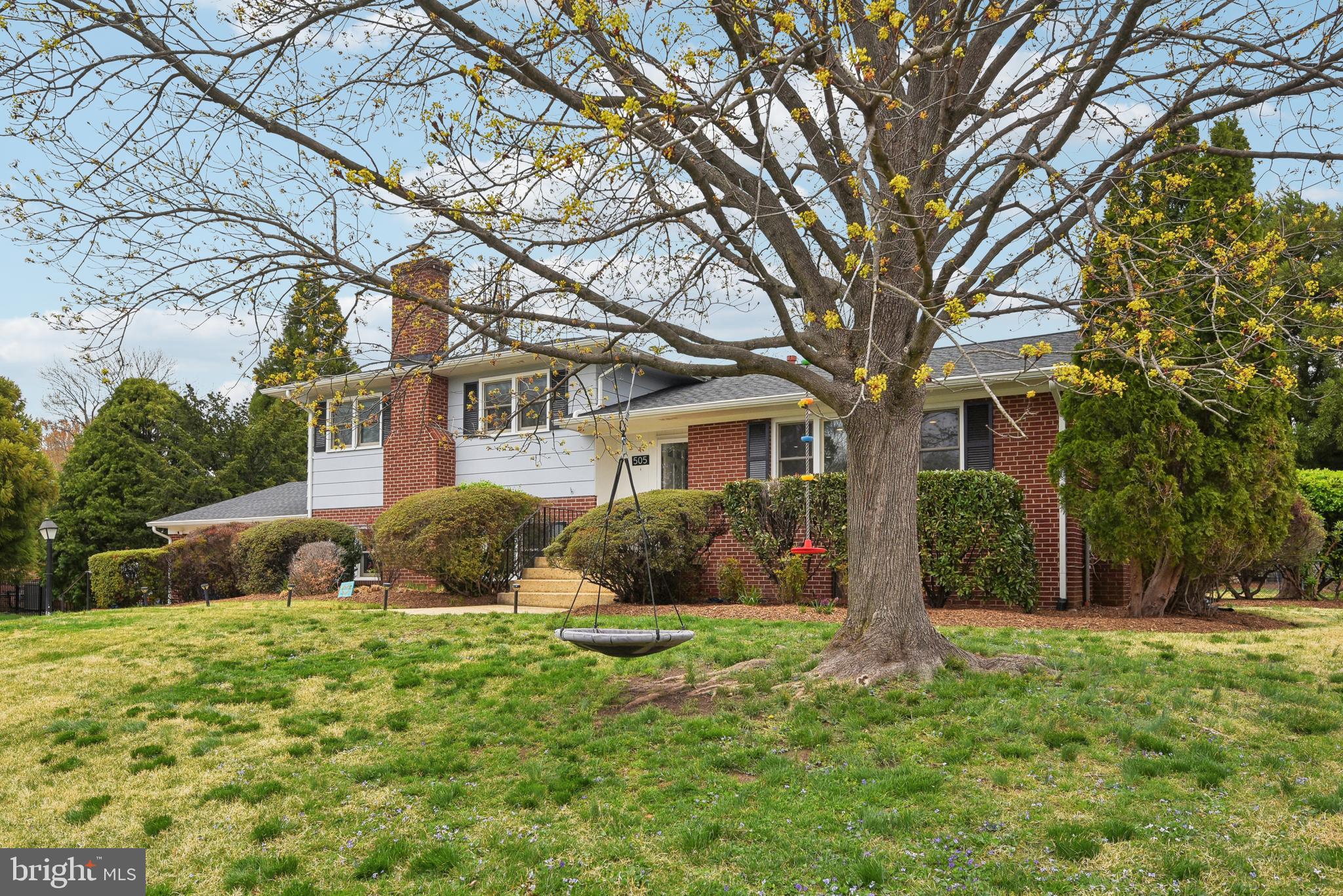 505 Devonshire Drive Northeast Vienna, VA 22180 - Photo 2 of 46 a front view of house with yard and green space