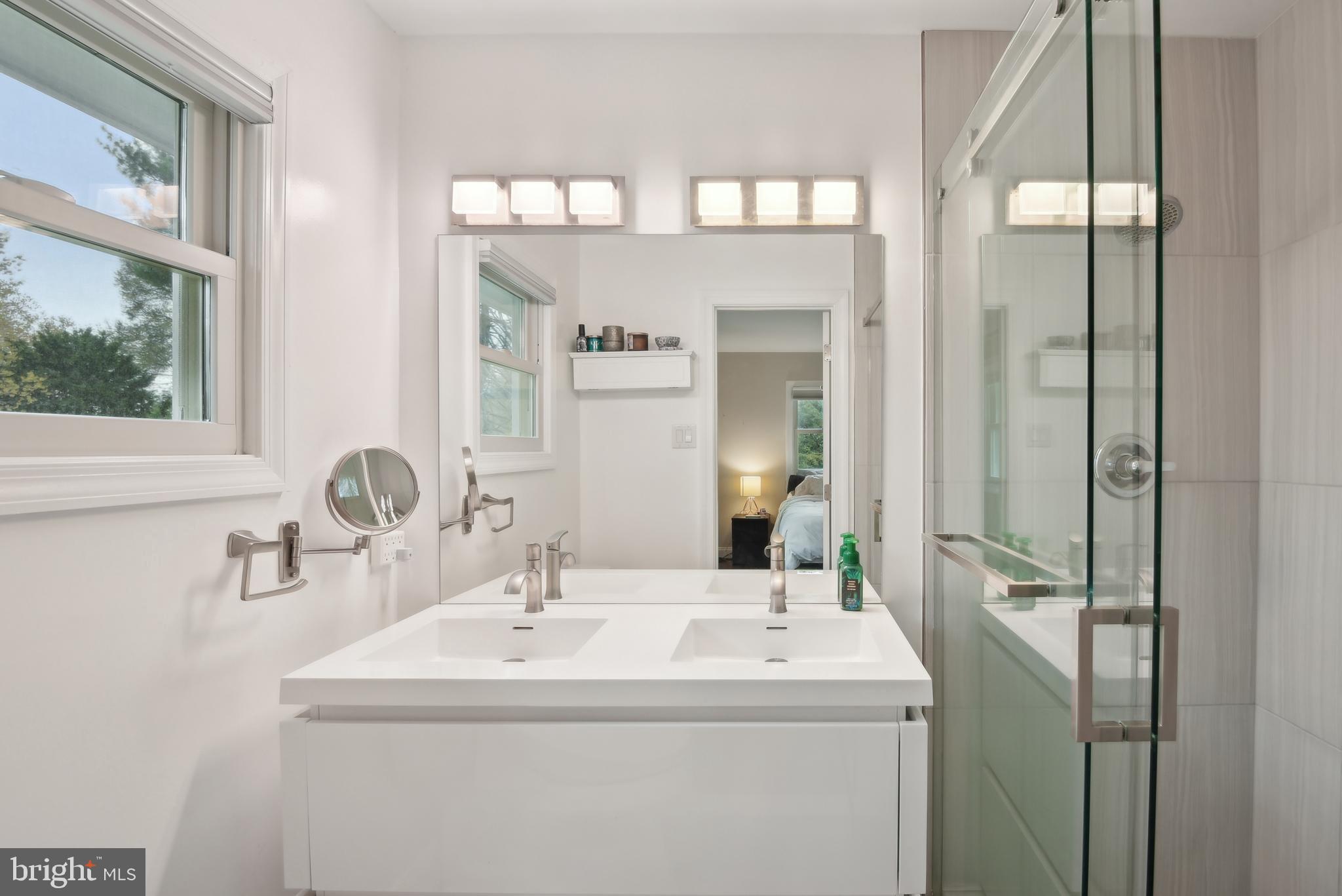 505 Devonshire Drive Northeast Vienna, VA 22180 - Photo 22 of 46 a bathroom with a sink and a mirror