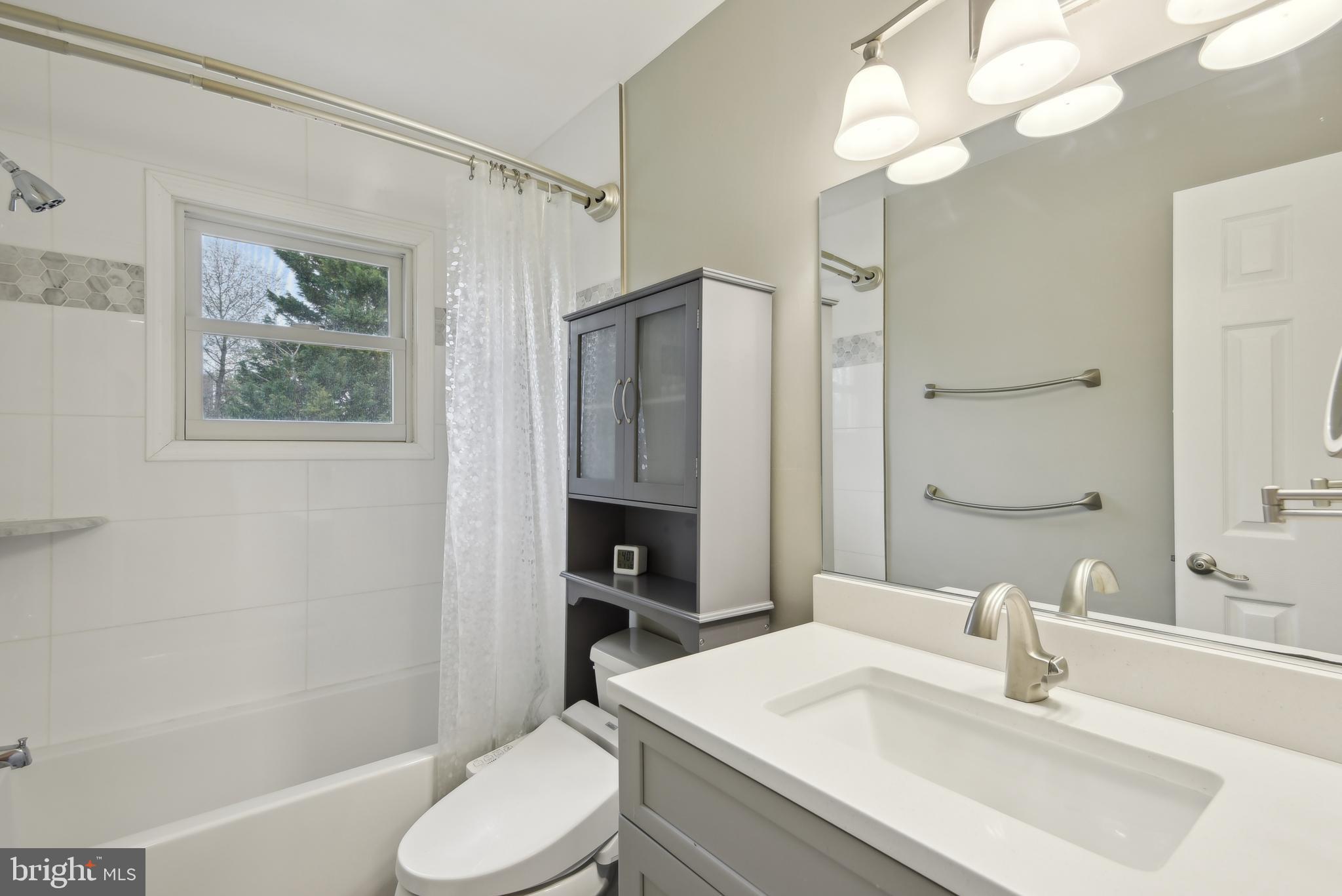 505 Devonshire Drive Northeast Vienna, VA 22180 - Photo 23 of 46 a bathroom with a sink toilet and shower