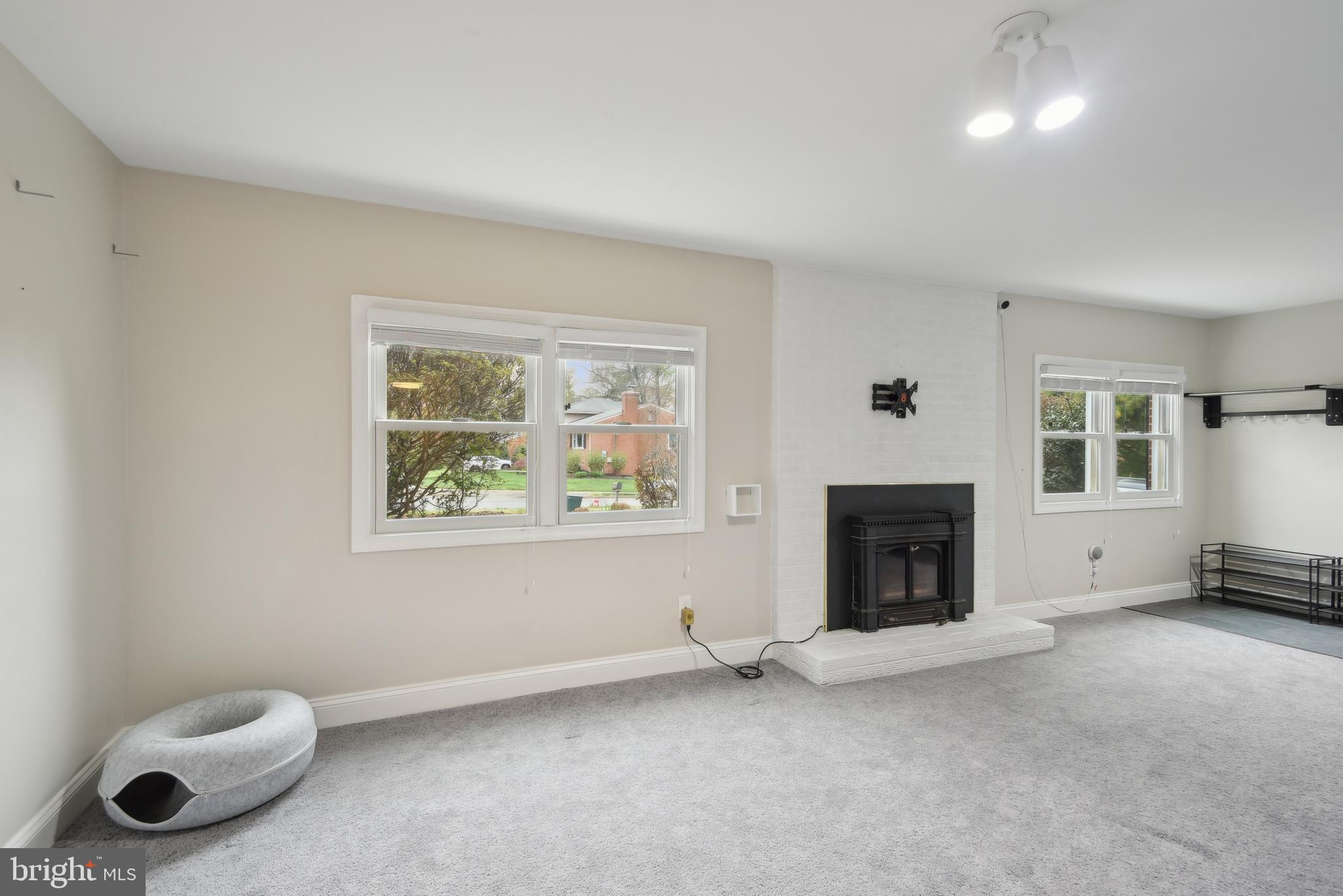 505 Devonshire Drive Northeast Vienna, VA 22180 - Photo 25 of 46 an empty room with furniture and a fireplace