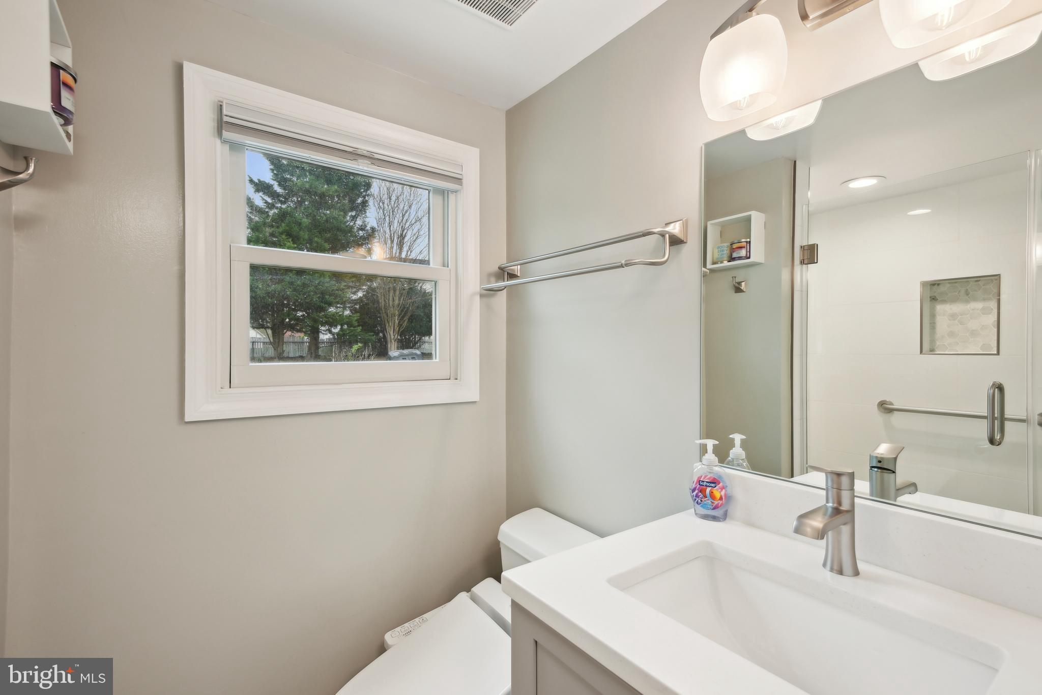 505 Devonshire Drive Northeast Vienna, VA 22180 - Photo 29 of 46 a bathroom with a sink and a mirror