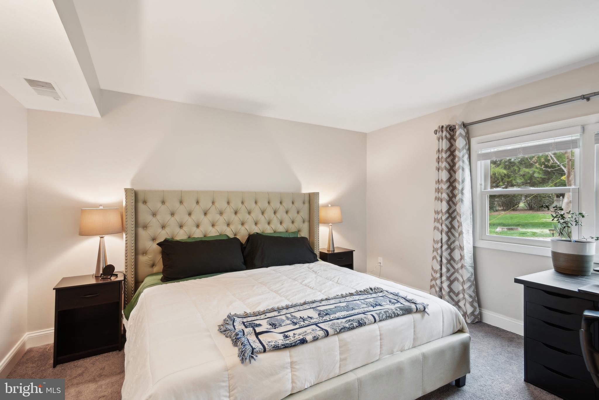 505 Devonshire Drive Northeast Vienna, VA 22180 - Photo 30 of 46 a bedroom with a bed and a window