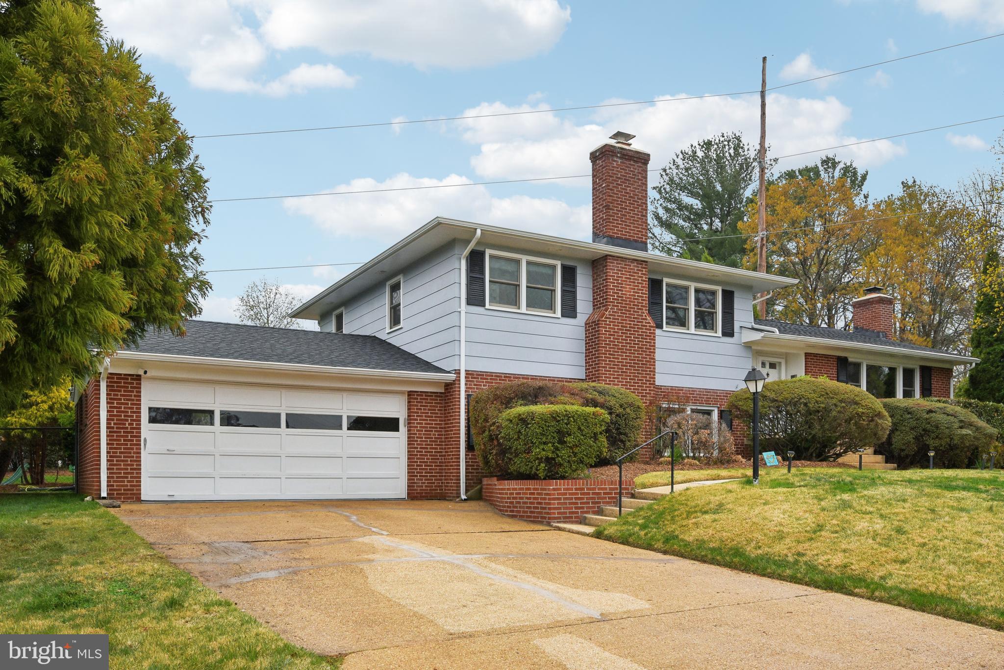 505 Devonshire Drive Northeast Vienna, VA 22180 - Photo 3 of 46 a front view of a house with garden