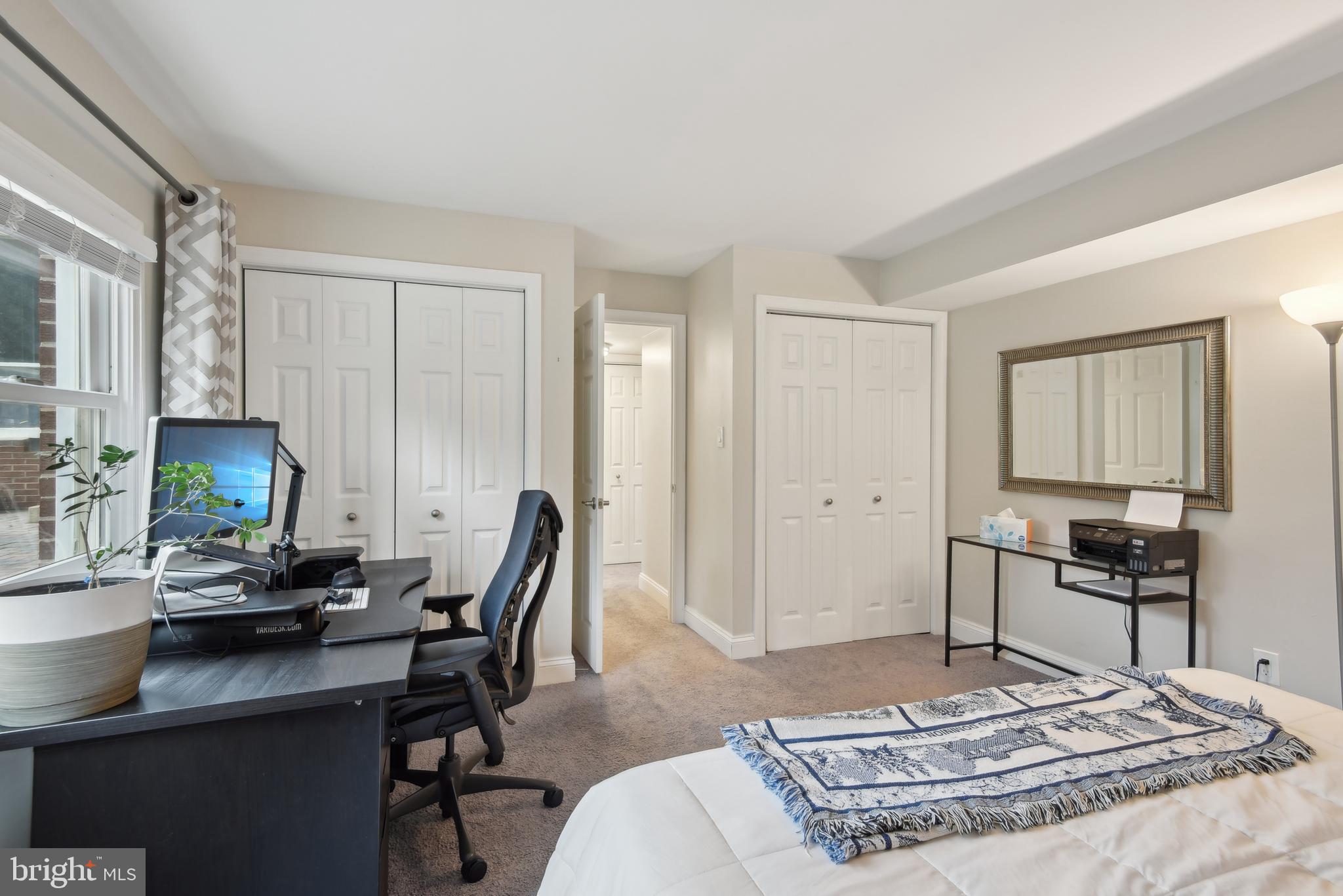 505 Devonshire Drive Northeast Vienna, VA 22180 - Photo 32 of 46 a living room with furniture a rug and a table