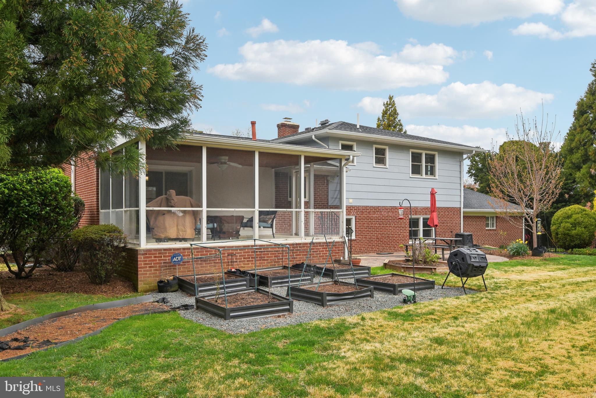 505 Devonshire Drive Northeast Vienna, VA 22180 - Photo 38 of 46 a view of a house with backyard sitting area and garden