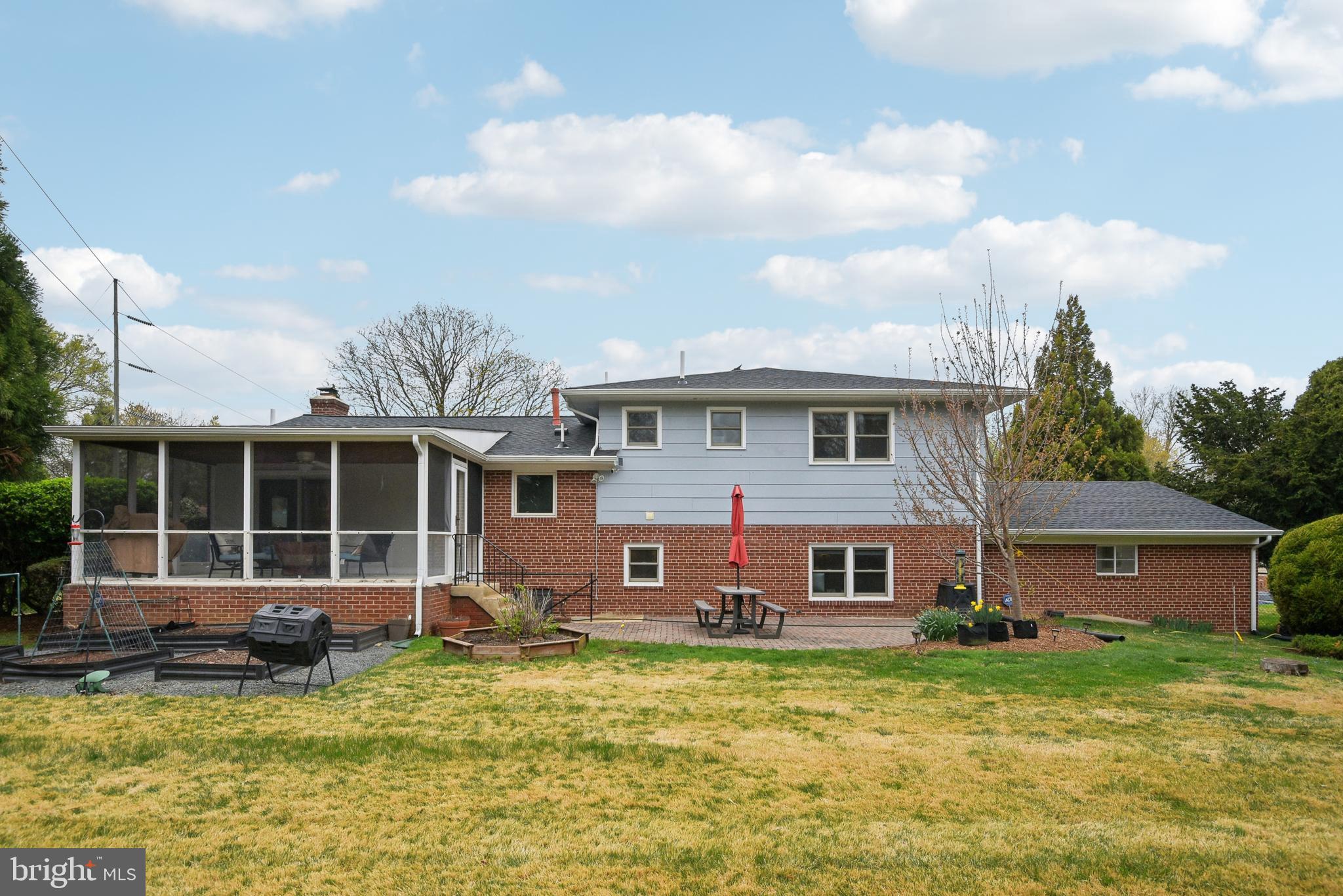 505 Devonshire Drive Northeast Vienna, VA 22180 - Photo 39 of 46 a view of a house with a big yard and potted plants