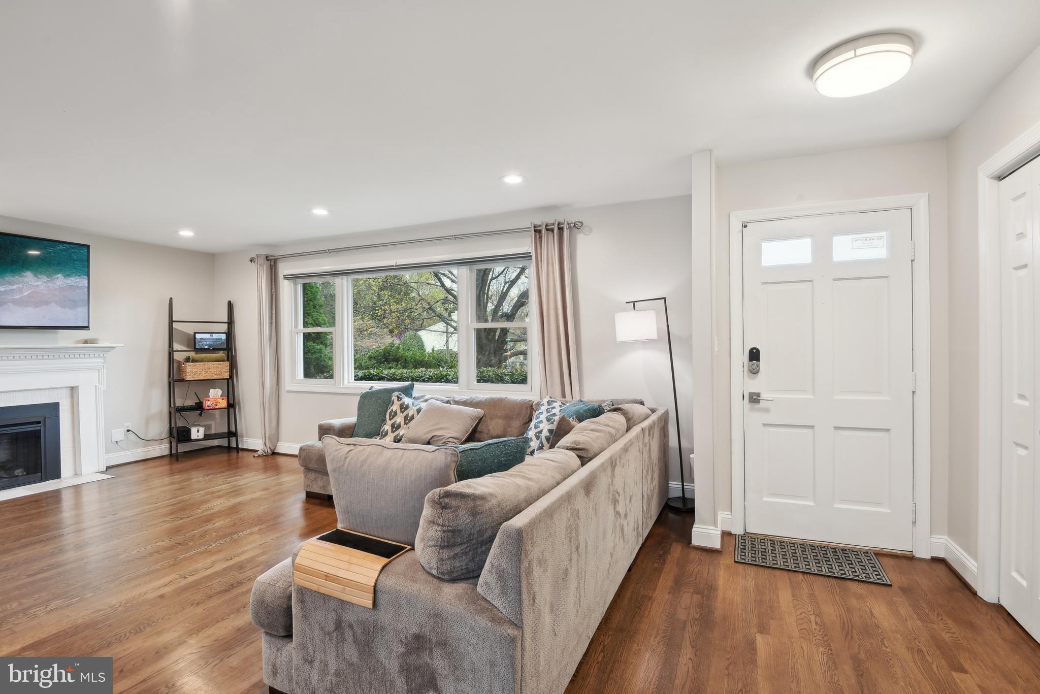 505 Devonshire Drive Northeast Vienna, VA 22180 - Photo 4 of 46 a living room with furniture and a fireplace