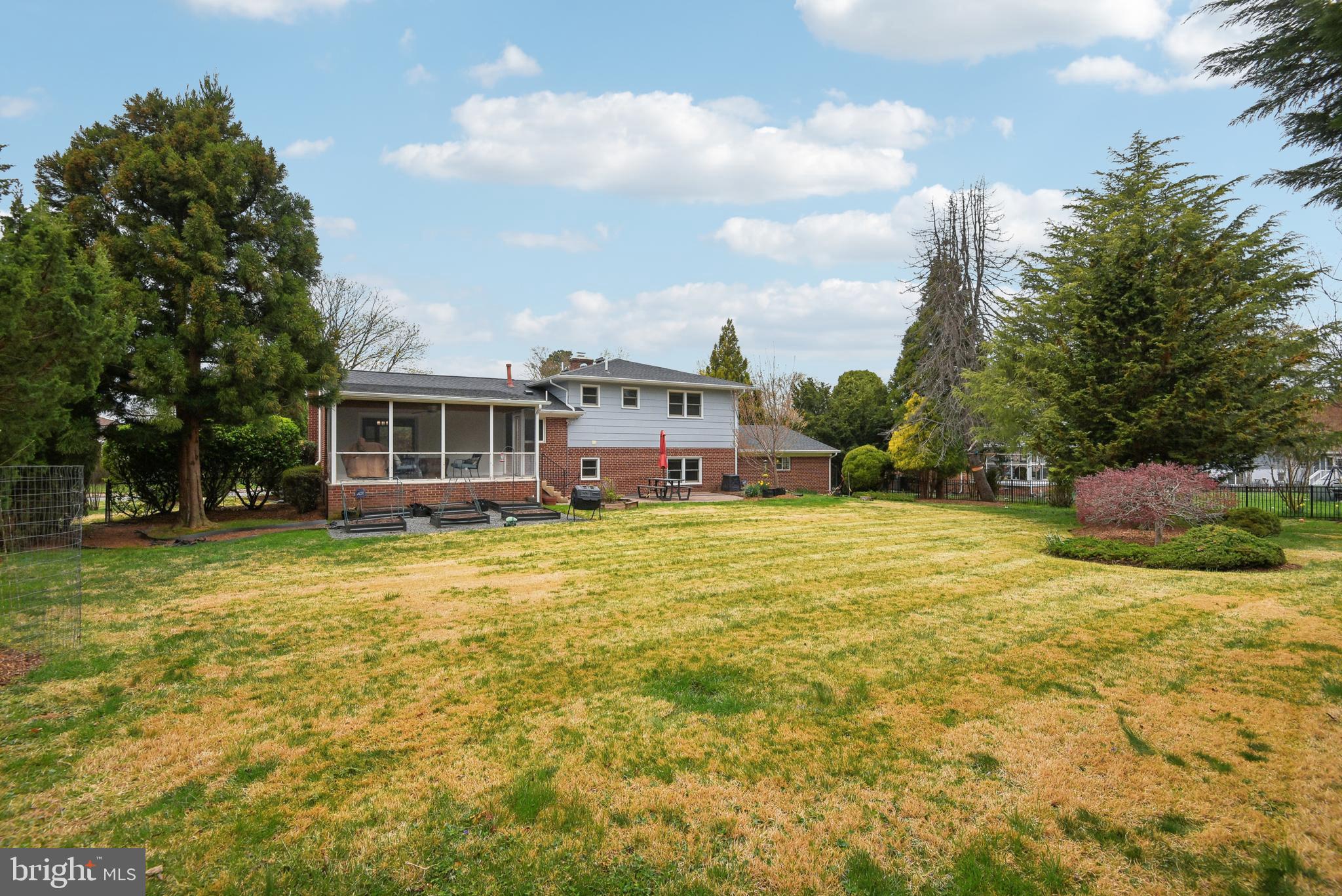 505 Devonshire Drive Northeast Vienna, VA 22180 - Photo 41 of 46 a swimming pool with yard and trees in the background