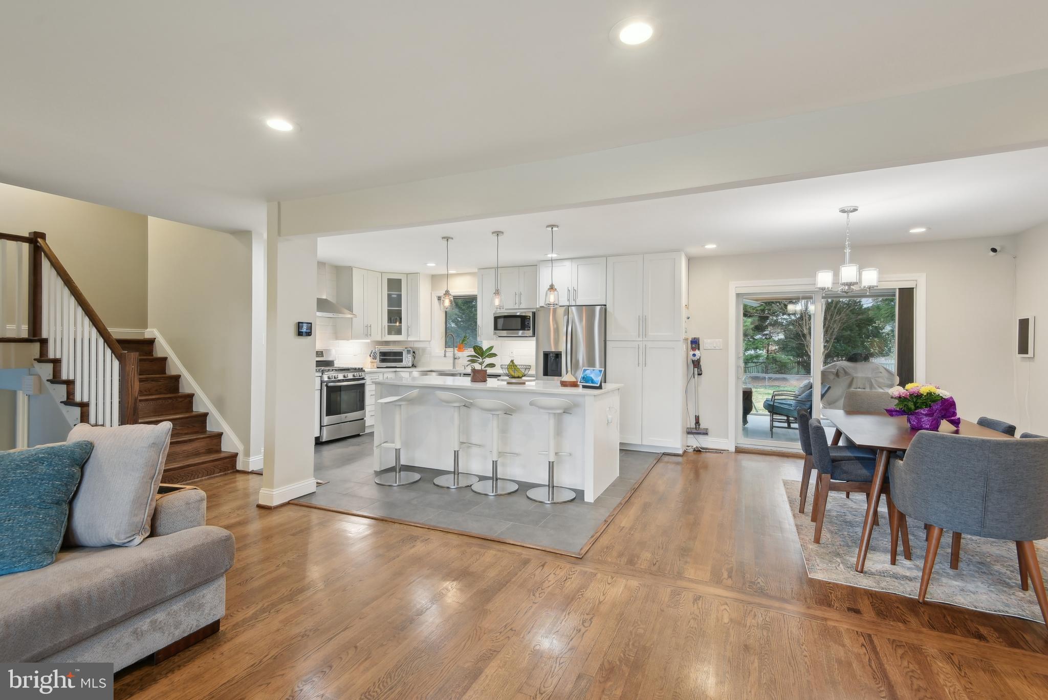 505 Devonshire Drive Northeast Vienna, VA 22180 - Photo 9 of 46 a living room with furniture and a dining table with kitchen view