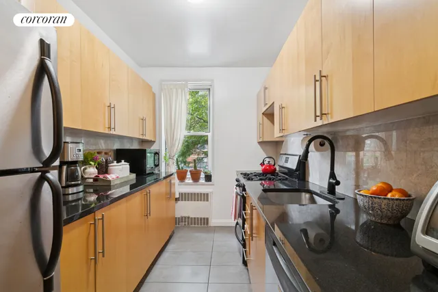 a living room with furniture and a book shelf