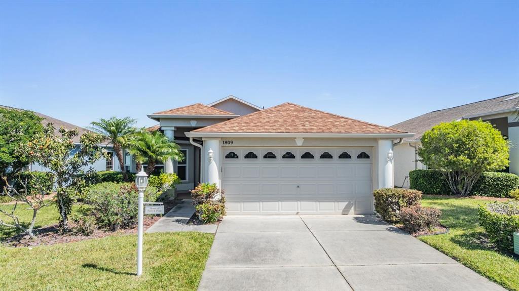 1809 Arbor Knoll Loop Trinity, FL 34655 - Photo 1 of 1 Covered entry and welcoming curb appeal