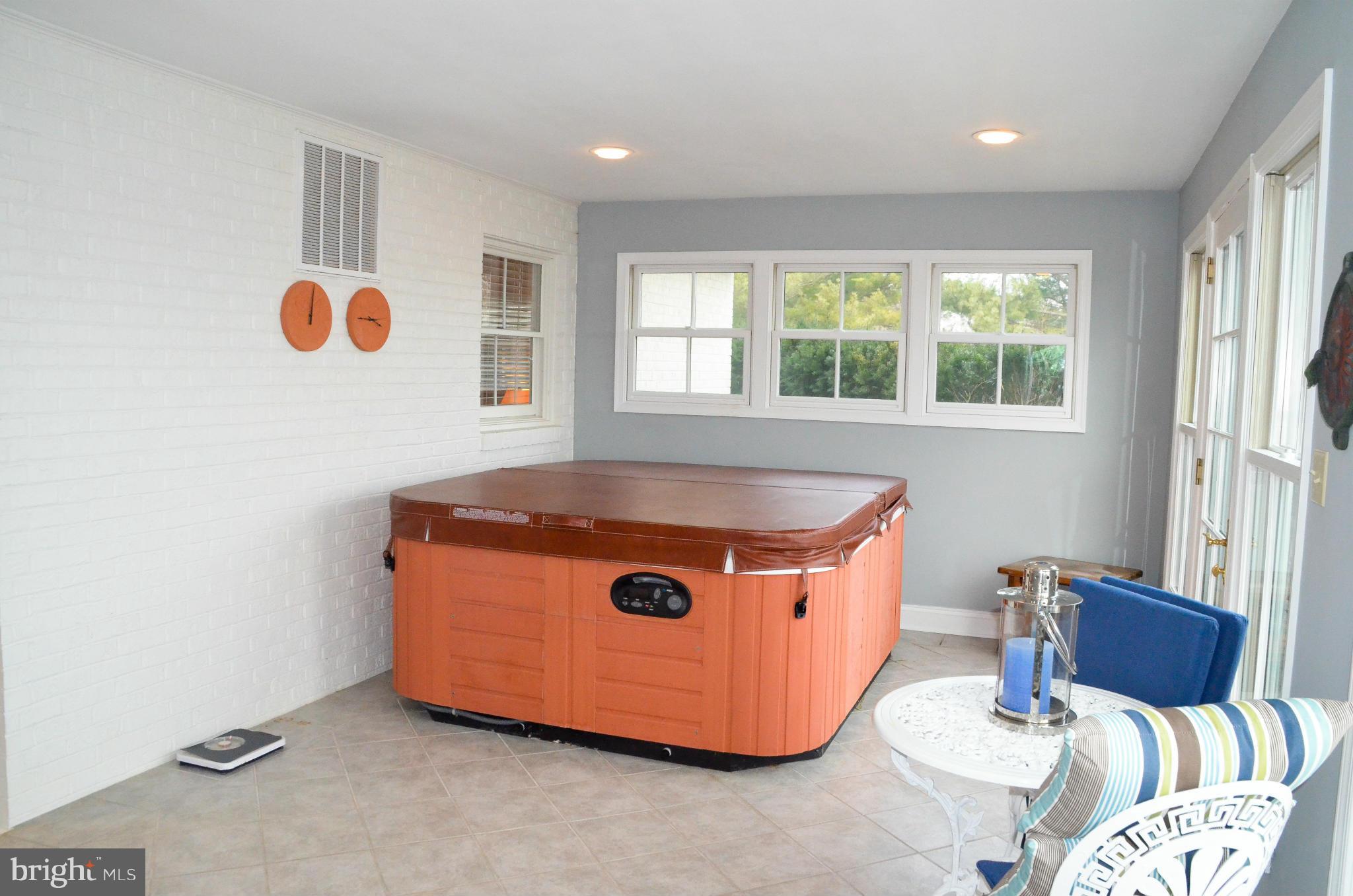 24870 Swan Road St. Michaels, MD 21663 - Photo 22 of 30 Enclosed porch with hot tub