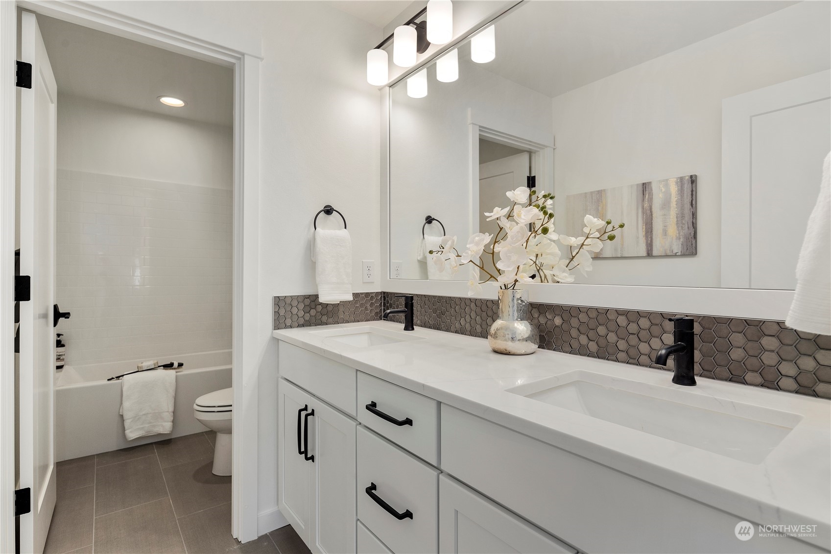15 179th Place Southwest Bothell, WA 98012 - Photo 29 of 30 a bathroom with a sink a toilet and mirror