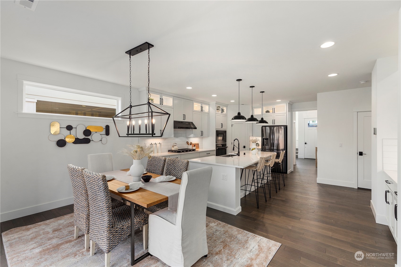 15 179th Place Southwest Bothell, WA 98012 - Photo 5 of 30 a dining room with furniture a chandelier and wooden floor