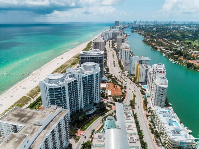 a view of an empty room and a window