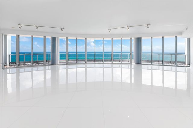 a view of an empty room with a large window