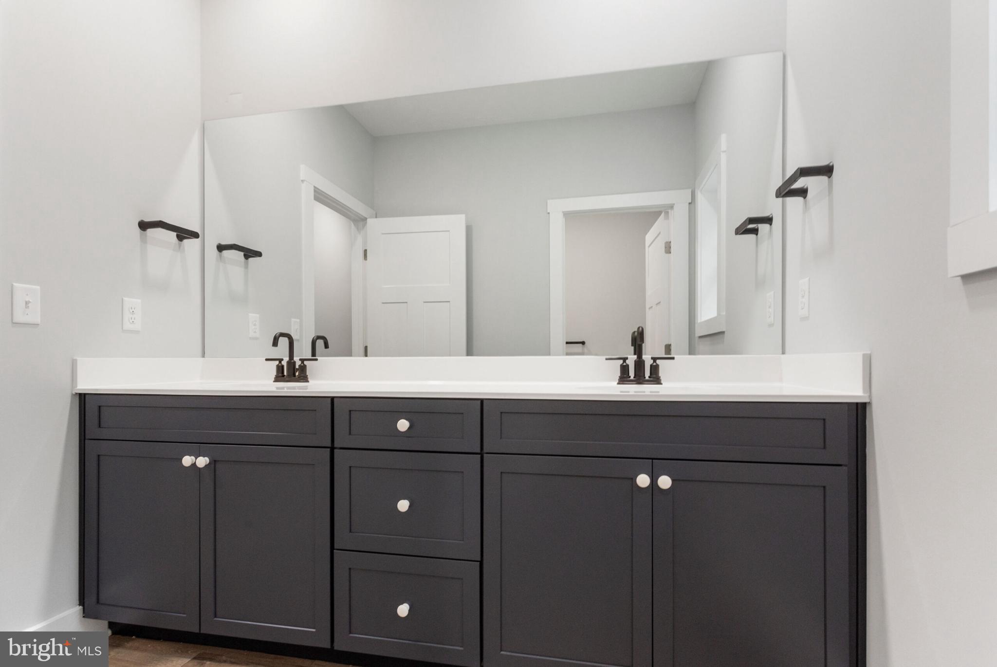 0 Log Cabin Road York, PA 17408 - Photo 14 of 23 Sleek modern bathroom with dual vanities.